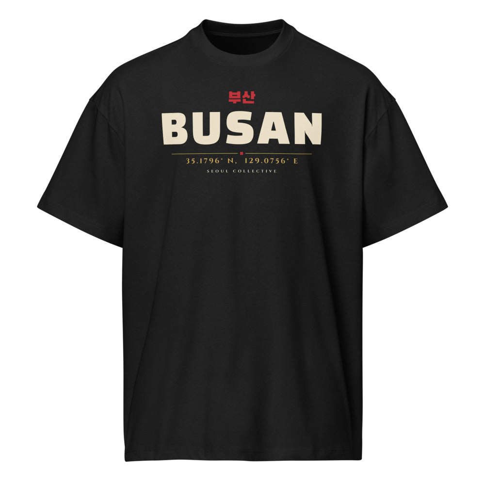 Busan Coordinates Tee, front: BUSAN with 부산 and the city's coordinates on a black oversized tee
