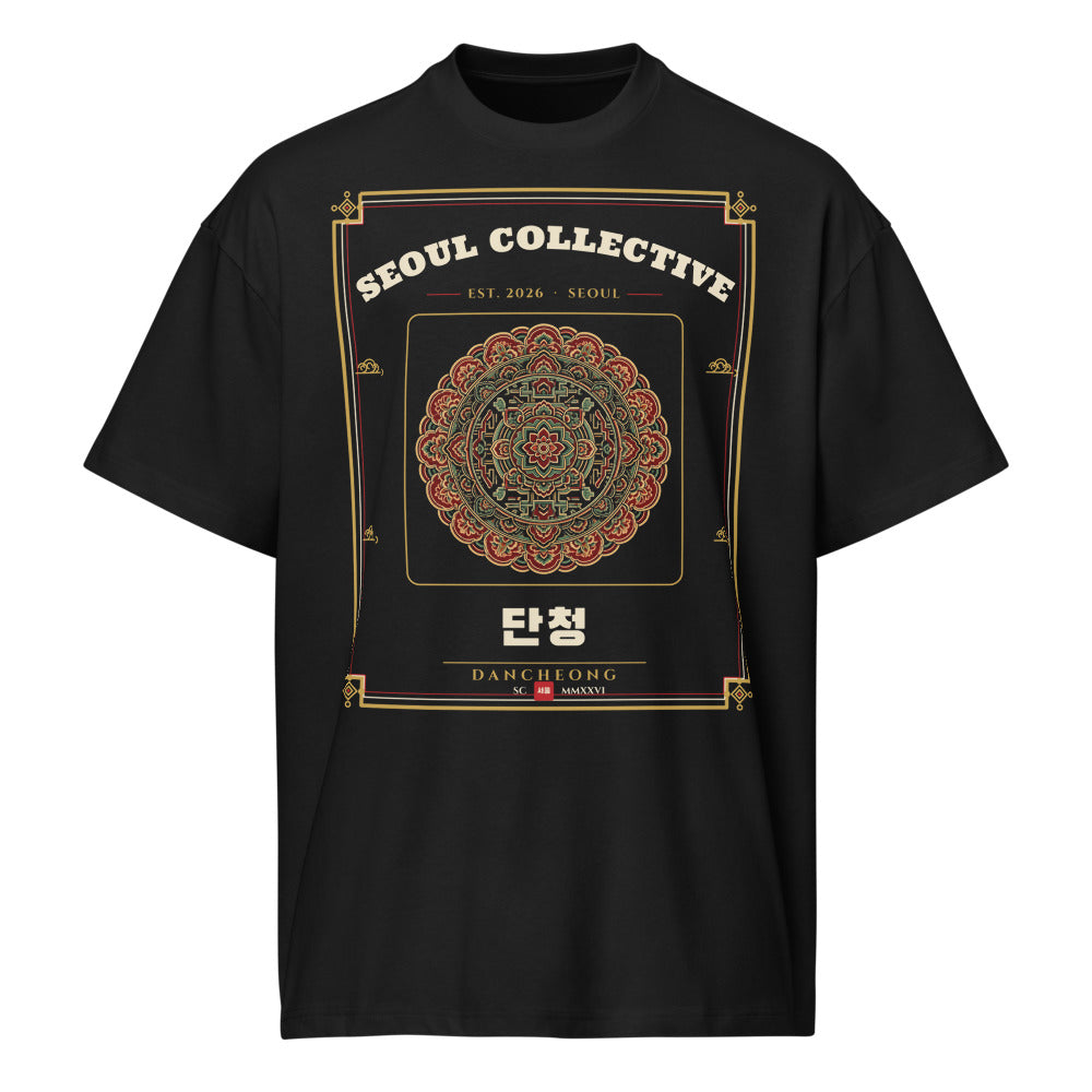 Dancheong Heritage Tee, front: a dancheong pattern medallion on a black oversized tee