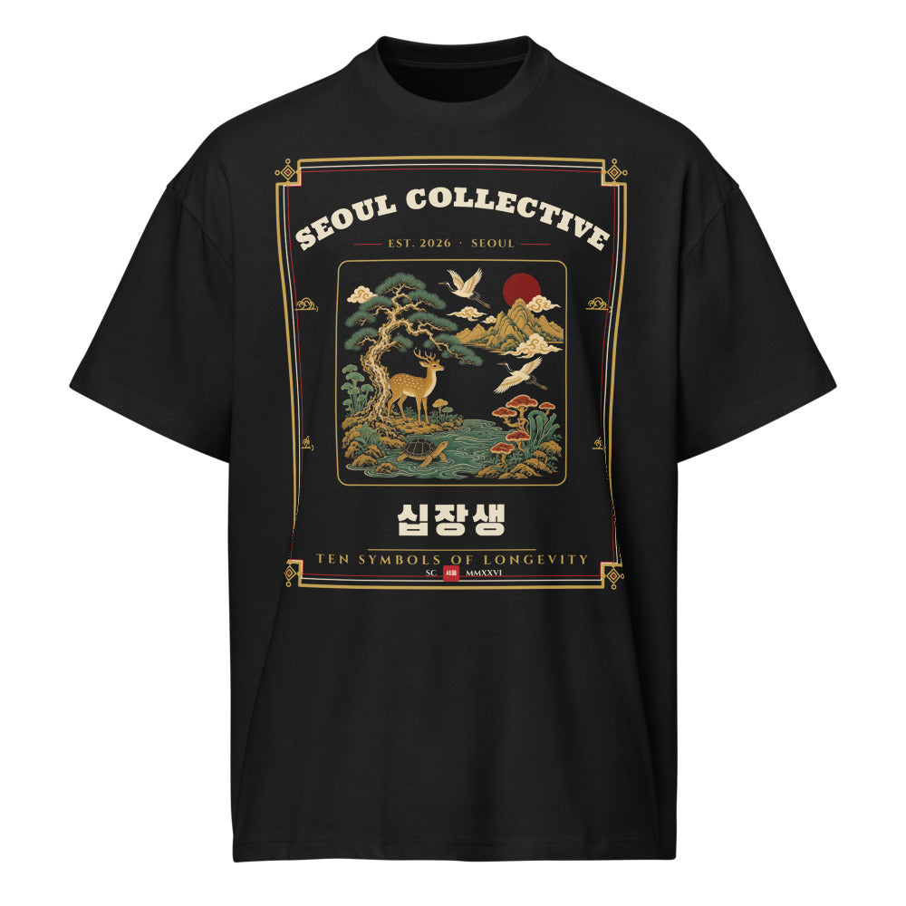 Ten Symbols of Longevity Heritage Tee, front: the ten symbols of long life, including pine, crane, deer and turtle, on a black oversized tee