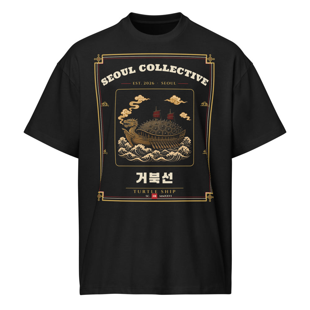 Turtle Ship Heritage Tee, front: a geobukseon turtle ship with a spiked covered roof and dragon head riding the waves, on a black oversized tee